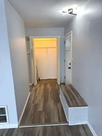 a view of a kitchen from the hallway