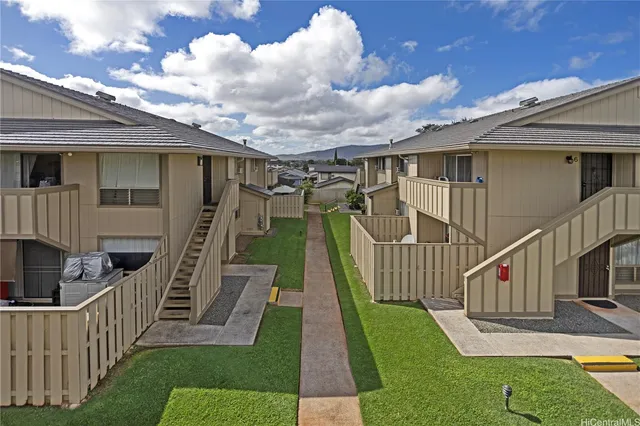 a view of a roof deck with wooden fence and floor