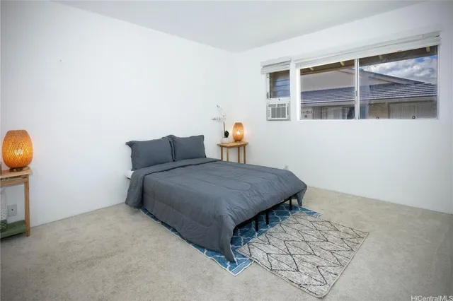 a bedroom with a bed and cabinets