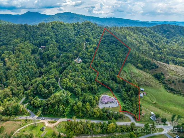 an aerial view of residential house with outdoor space