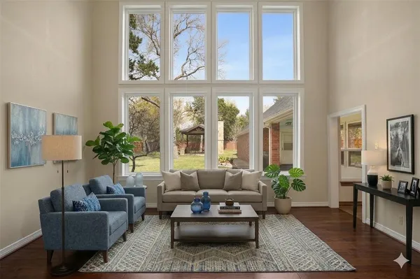 a living room with furniture or couch and a potted plant