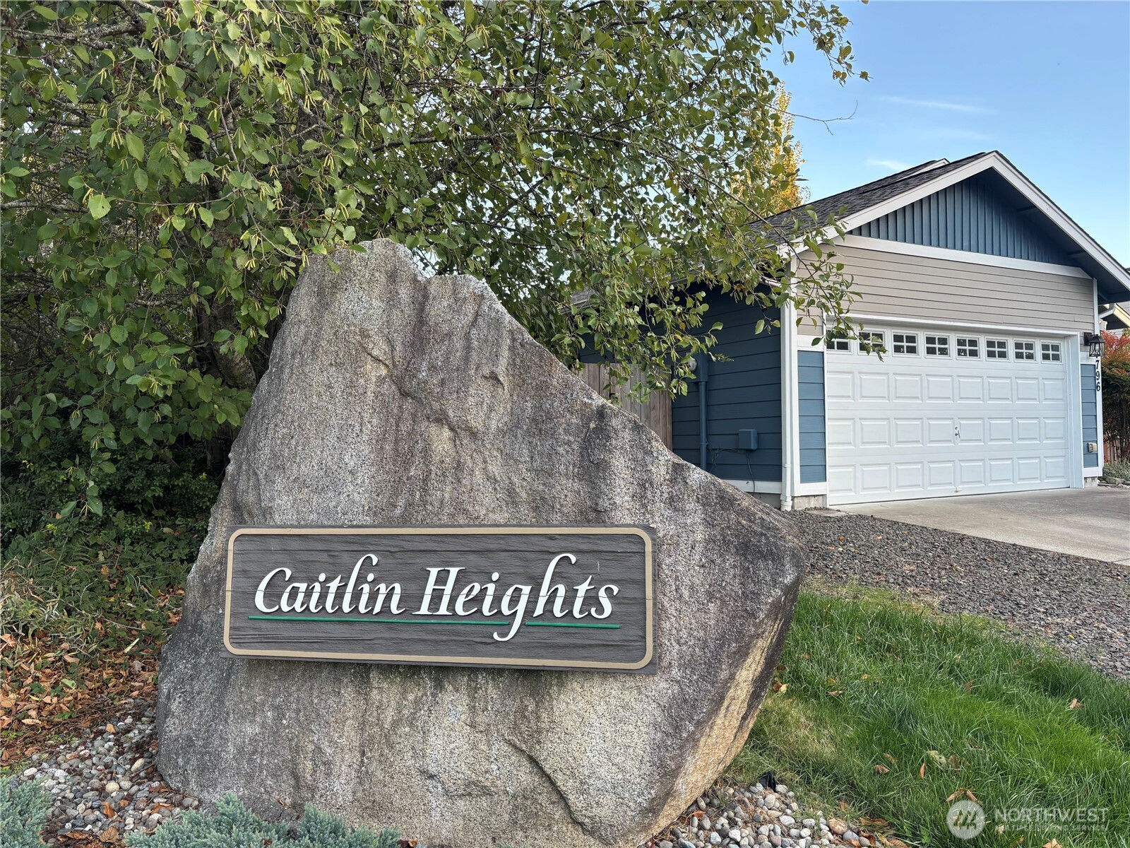 7796 Kildare Loop Northwest Silverdale, WA 98383 - Photo 14 of 14 a view of outdoor space with sign board