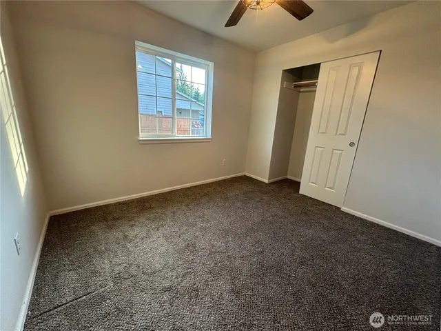 an empty room with a empty space and windows