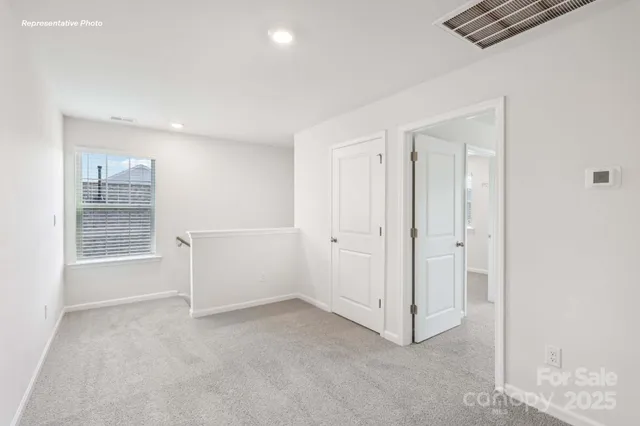 a view of workspace with cabinet and windows