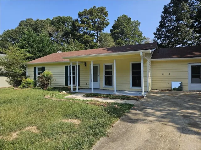 front view of a house and a yard