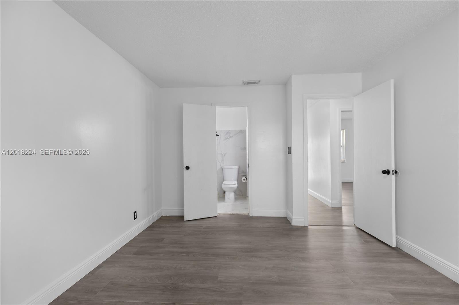 7958 Southwest 6th Street Pompano Beach, FL 33068 - Photo 24 of 57 a view of empty room with wooden floor