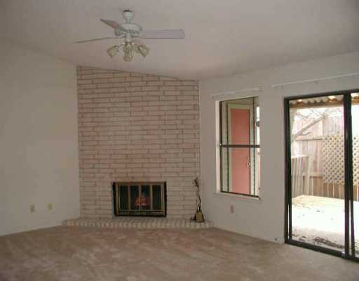 3815 Manchaca Road, Unit 10 Austin, TX 78704 - Photo 1 of 1 a view of an empty room with a fireplace