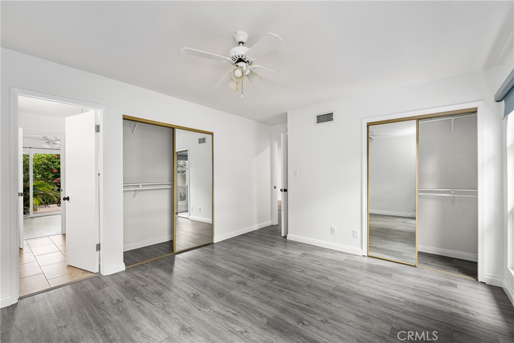 96 Seton Road Irvine, CA 92612 - Photo 26 of 35 an empty room with wooden floor closet and windows