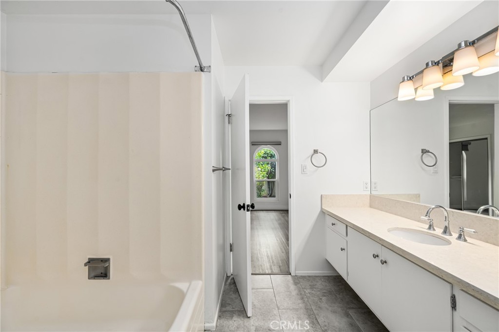 96 Seton Road Irvine, CA 92612 - Photo 30 of 35 a spacious bathroom with a double vanity sink a mirror and a bathtub