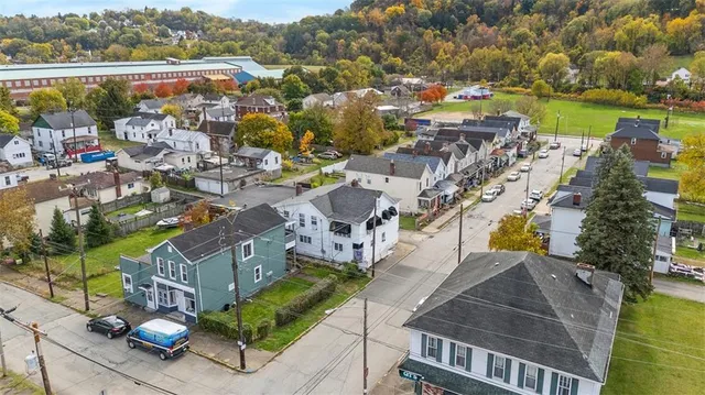 an aerial view of a house with a garden