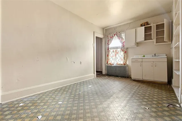 a view of a big room with windows