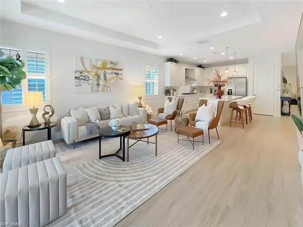 a living room with furniture and a table