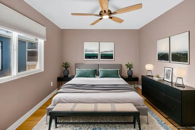 a bedroom with a bed and a window