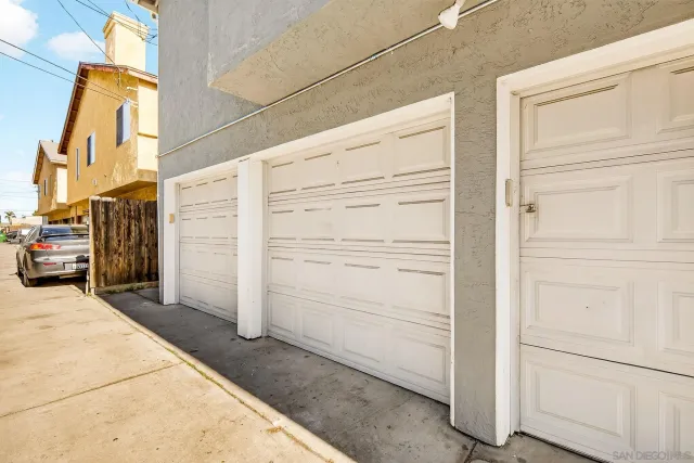 a backyard of a house with table and chairs