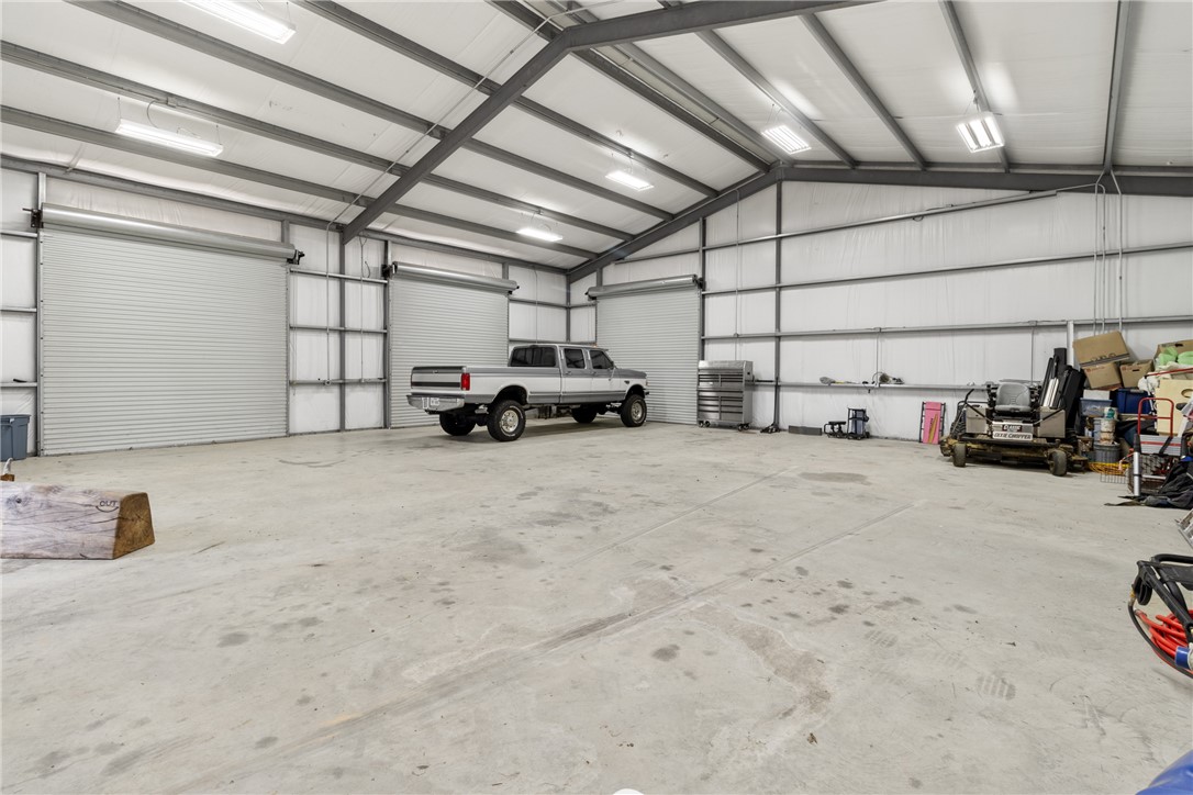 1725 Stokes Road New Ulm, TX 78950 - Photo 20 of 50 a view of parking garage with cars