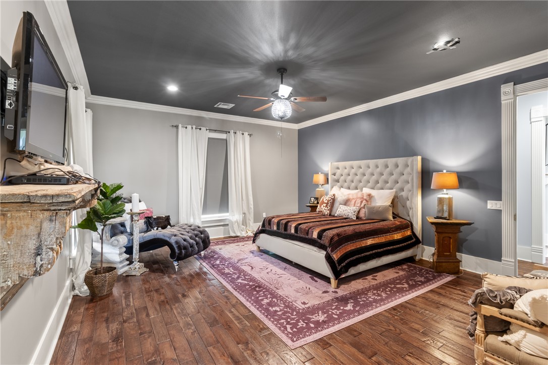 1725 Stokes Road New Ulm, TX 78950 - Photo 29 of 50 a bedroom with furniture and a fireplace