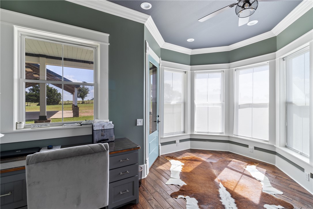 1725 Stokes Road New Ulm, TX 78950 - Photo 34 of 50 Home office featuring ceiling fan, dark wood-type flooring, and ornamental molding