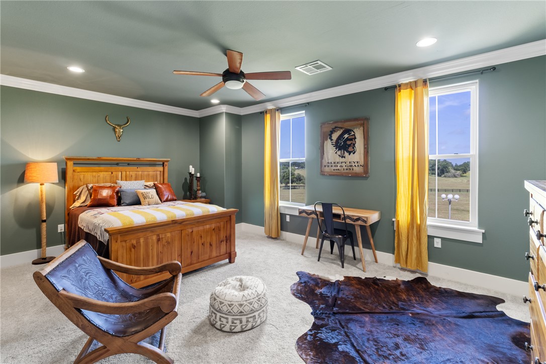 1725 Stokes Road New Ulm, TX 78950 - Photo 41 of 50 a bedroom with a bed and wooden floor