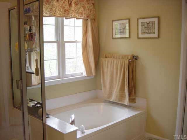 5252 Fairmead Circle Raleigh, NC 27613 - Photo 5 of 12 The master bath features a separate shower with new shower surround and a garden tub. The dual sinks are graced with new granite transformation c-tops, new faucets, hardware and new lighting. Bath also has a water closet & walk-in closet. Other