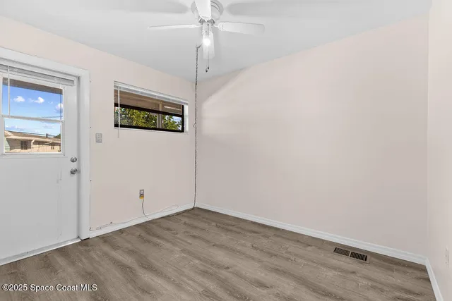a view of balcony with wooden floor