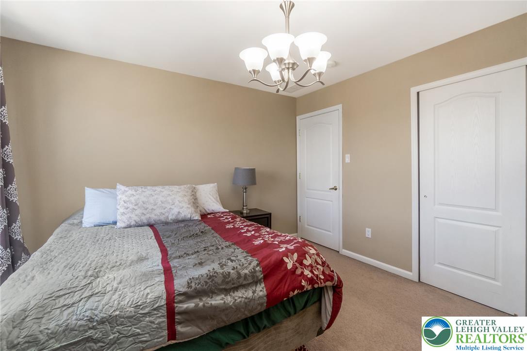 3566 Penfield Way Nazareth, PA 18064 - Photo 34 of 47 A well-appointed bedroom features ample natural light and a welcoming ambiance.