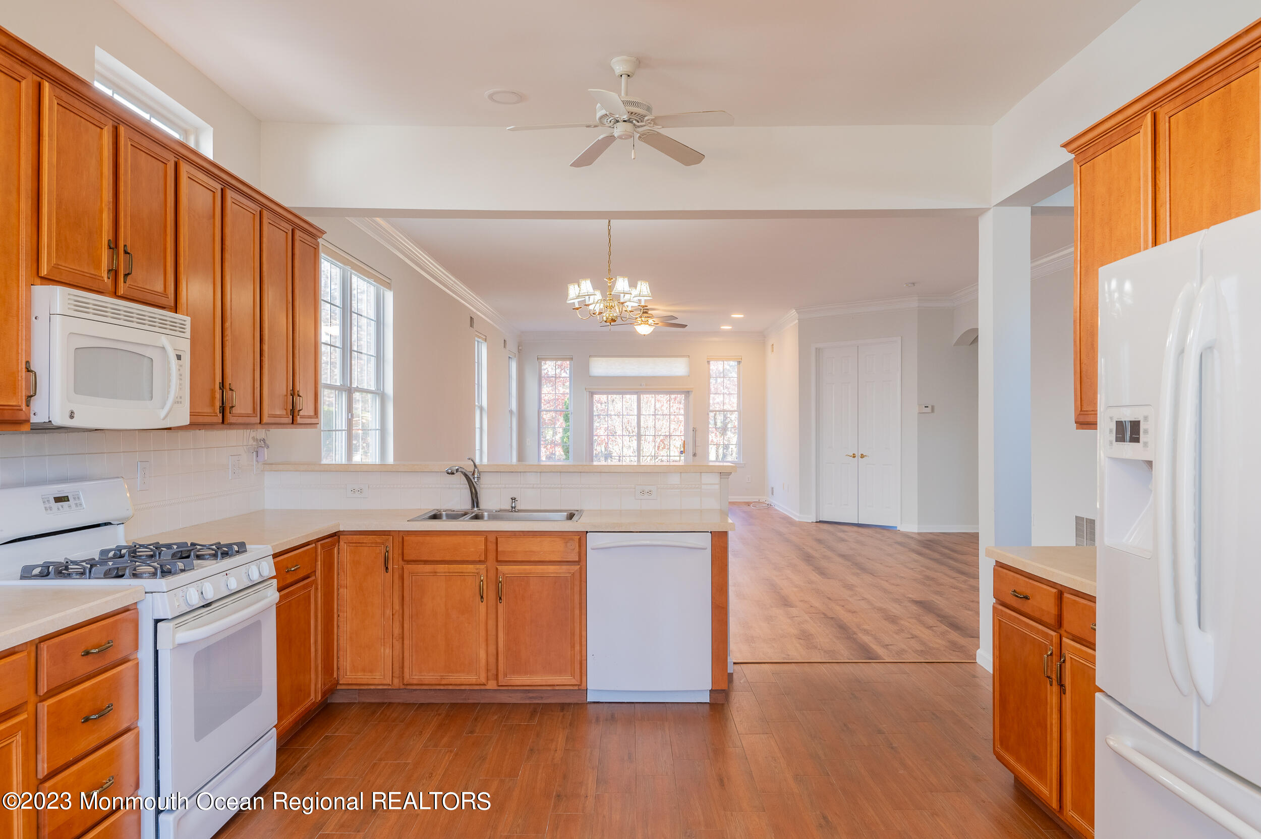27 Shoal Road Jackson, NJ 08527 - Photo 14 of 42 a kitchen with a sink cabinets stainless steel appliances and a window