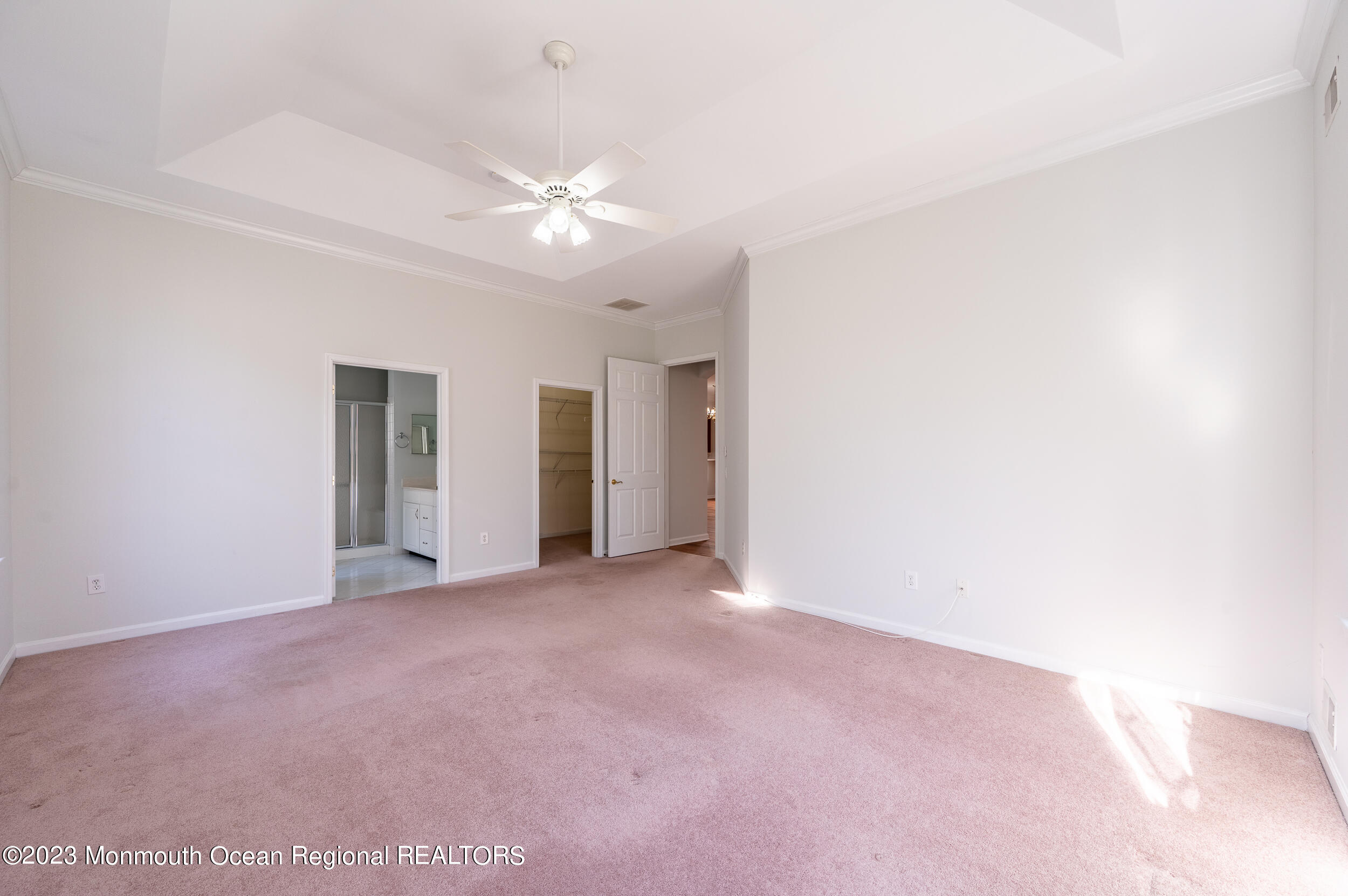 27 Shoal Road Jackson, NJ 08527 - Photo 23 of 42 an empty room with chandelier fan and windows