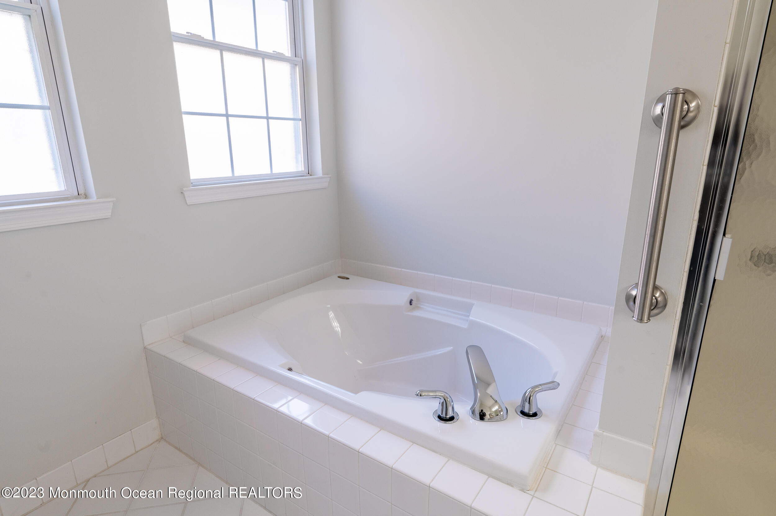 27 Shoal Road Jackson, NJ 08527 - Photo 28 of 42 a white bath tub sitting in a bathroom