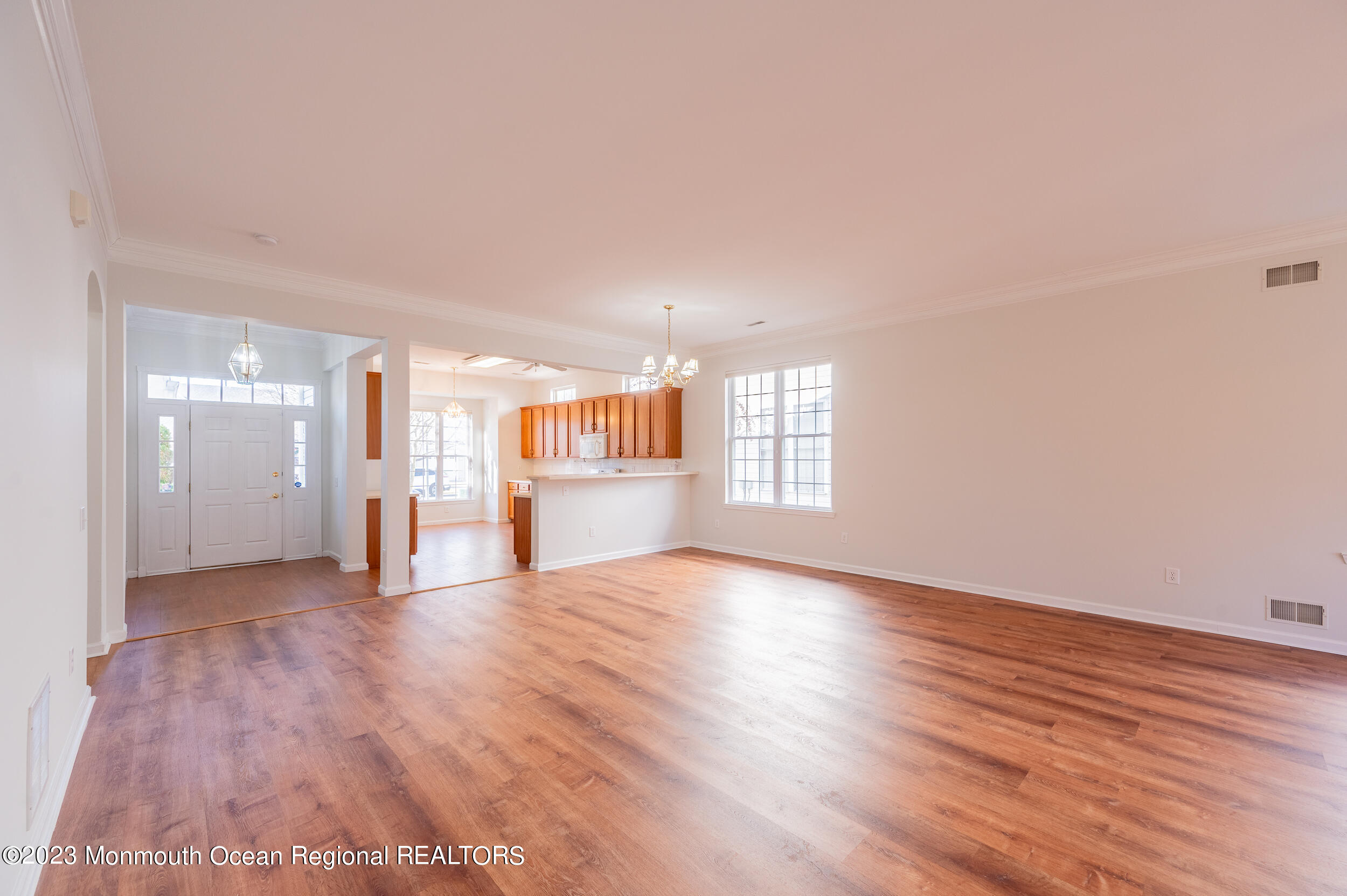 27 Shoal Road Jackson, NJ 08527 - Photo 10 of 42 a view of empty room with wooden floor and window