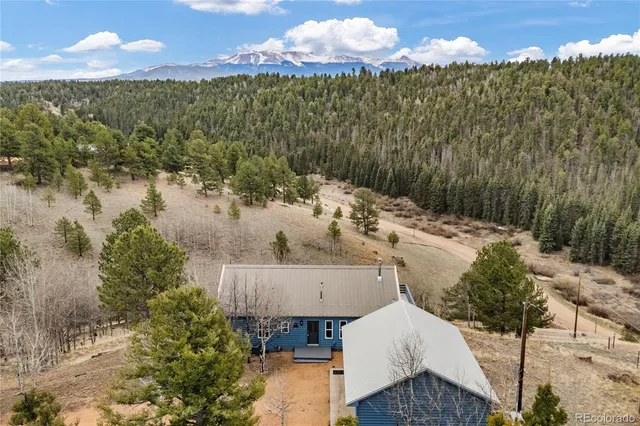a view of a backyard with sitting area