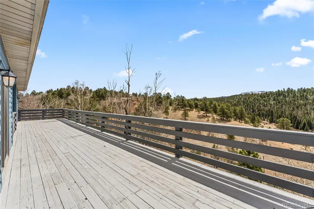 a view of a balcony with wooden floor