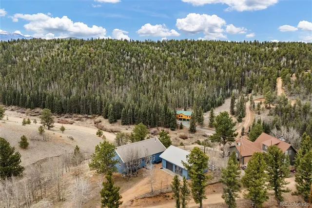 a view of a lake with lawn chairs