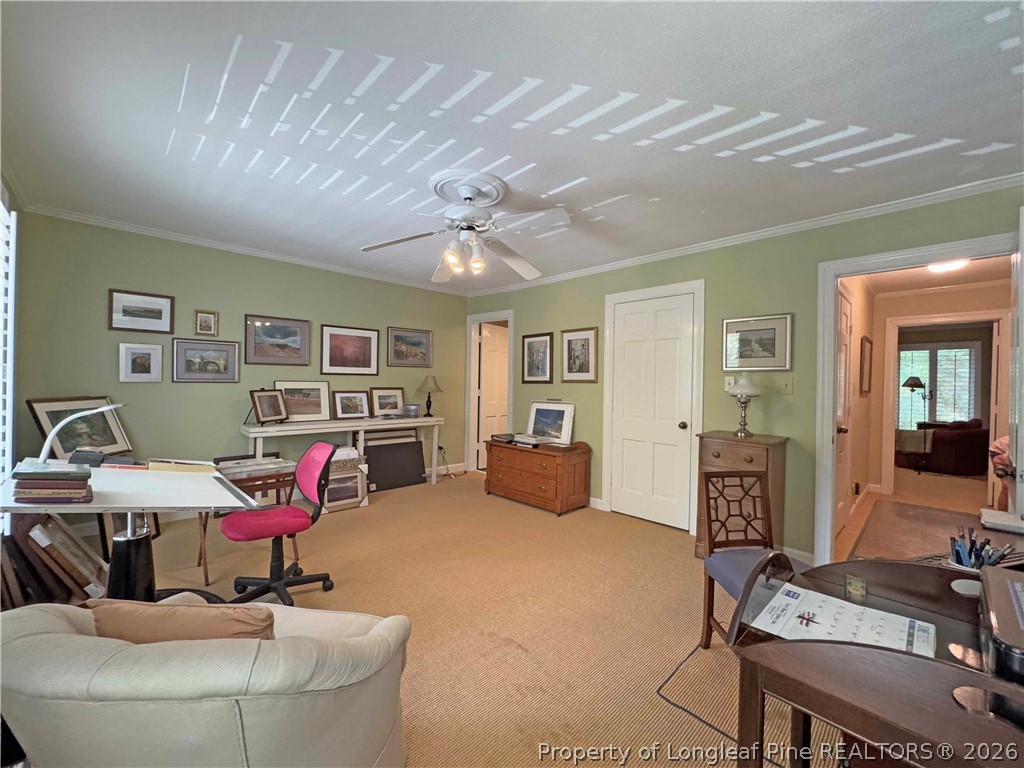 190 Palmetto Road Pinehurst, NC 28374 - Photo 16 of 19 a living room with furniture and a flat screen tv