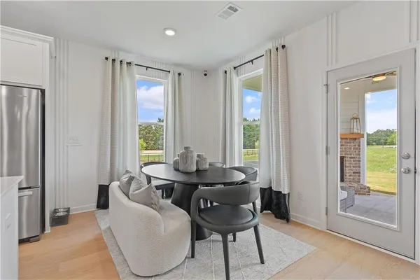a dining room with furniture and window