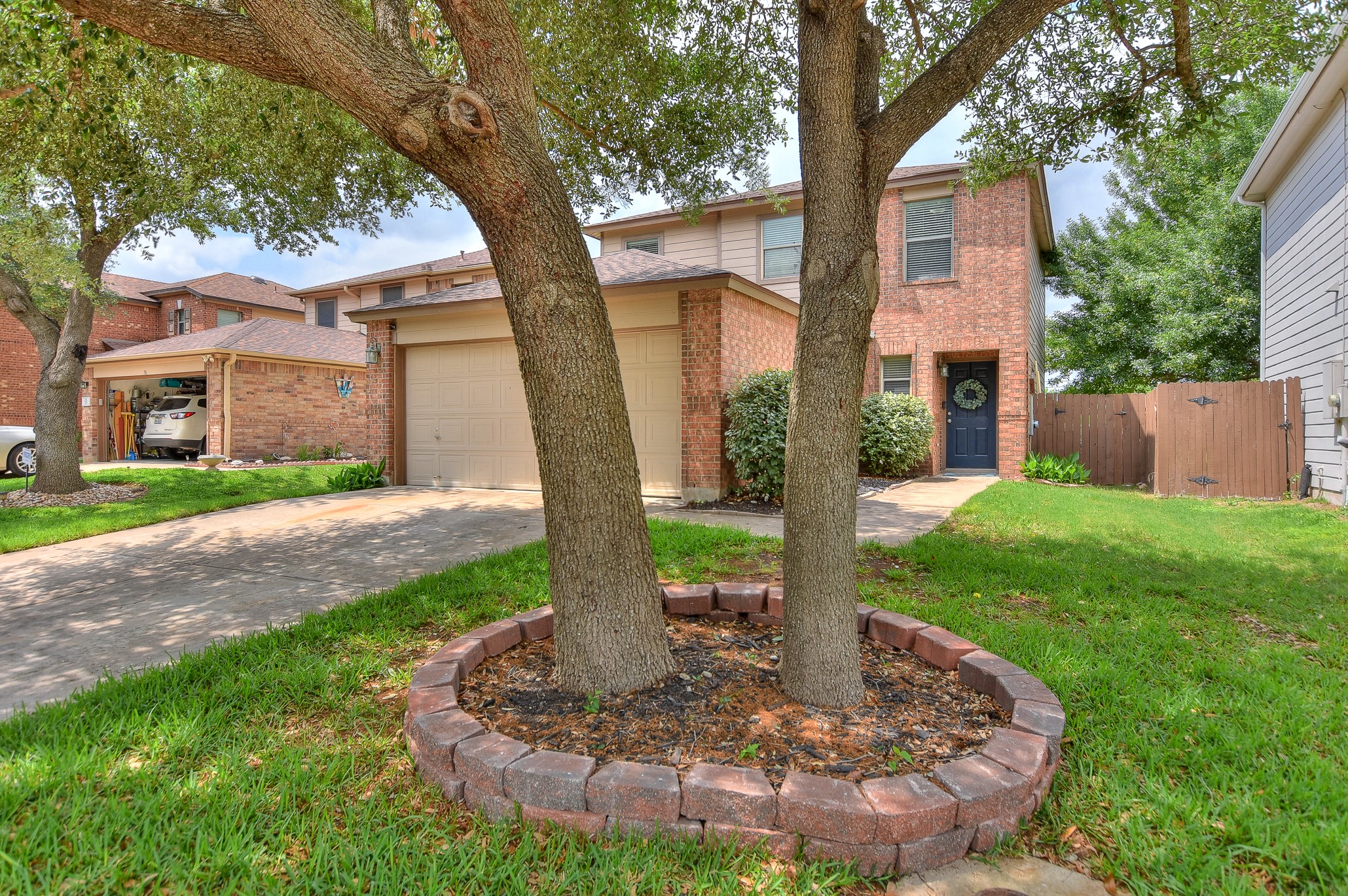74 Jan Lane Georgetown, TX 78626 - Photo 3 of 31 a front view of a house with garden