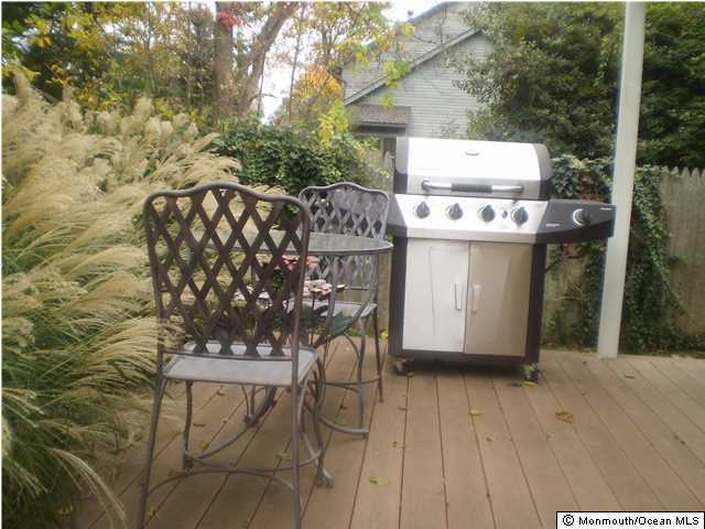 539 Woodland Avenue Brielle, NJ 08730 - Photo 17 of 20 a view of a chairs and table on the wooden floor