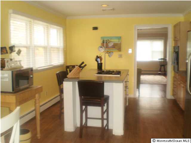 539 Woodland Avenue Brielle, NJ 08730 - Photo 2 of 20 a view of a dining room with furniture and a window
