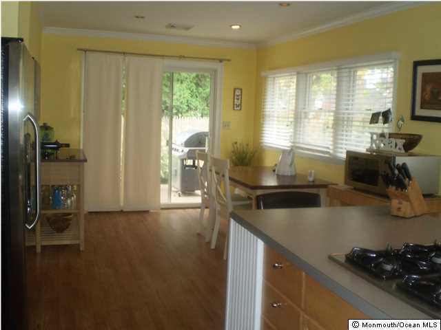 539 Woodland Avenue Brielle, NJ 08730 - Photo 3 of 20 a kitchen with a sink stove and refrigerator