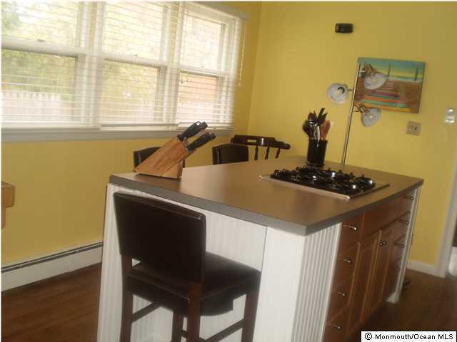 539 Woodland Avenue Brielle, NJ 08730 - Photo 4 of 20 a kitchen with a sink a counter top space and a window