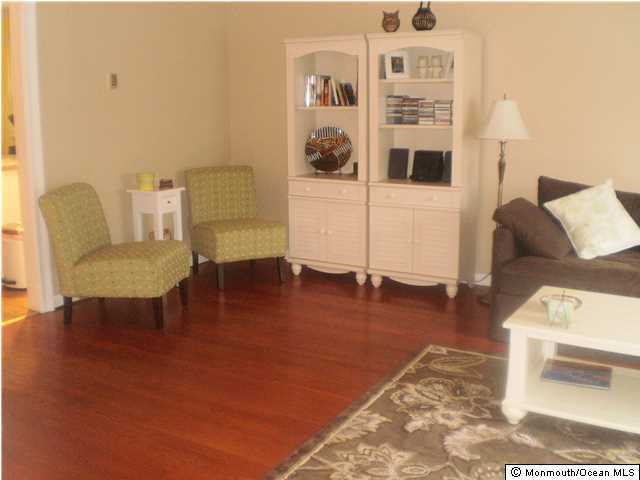 539 Woodland Avenue Brielle, NJ 08730 - Photo 5 of 20 a living room with furniture and a table