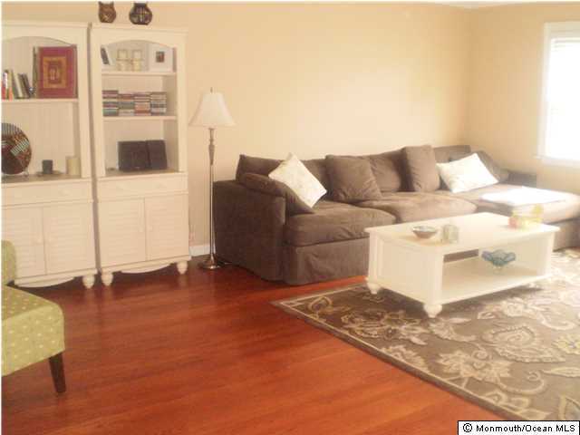 539 Woodland Avenue Brielle, NJ 08730 - Photo 6 of 20 a living room with furniture and a rug
