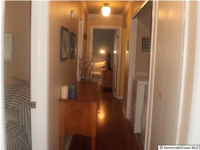 539 Woodland Avenue Brielle, NJ 08730 - Photo 10 of 20 a view of a hallway with a bathroom