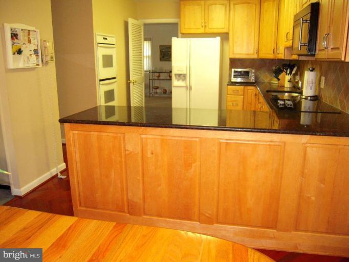 2202 Sugarcone Road Baltimore, MD 21209 - Photo 10 of 28 Kitchen Breakfast Area and door leads to Dining Rm