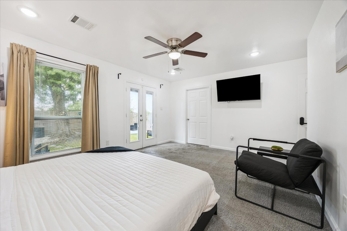 2631 Stevens Street Houston, TX 77026 - Photo 16 of 25 a bedroom with a bed and a flat screen tv