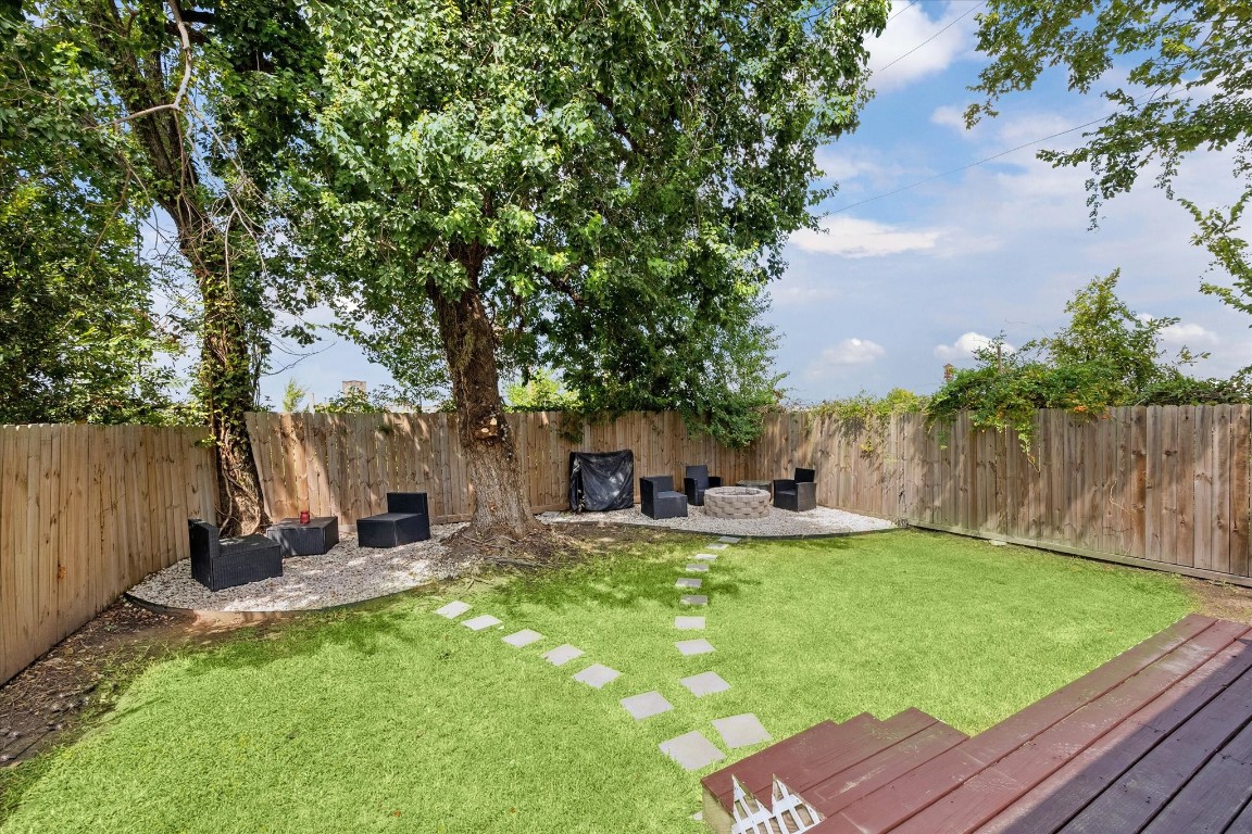 2631 Stevens Street Houston, TX 77026 - Photo 22 of 25 a view of a backyard with table and chairs and a slide