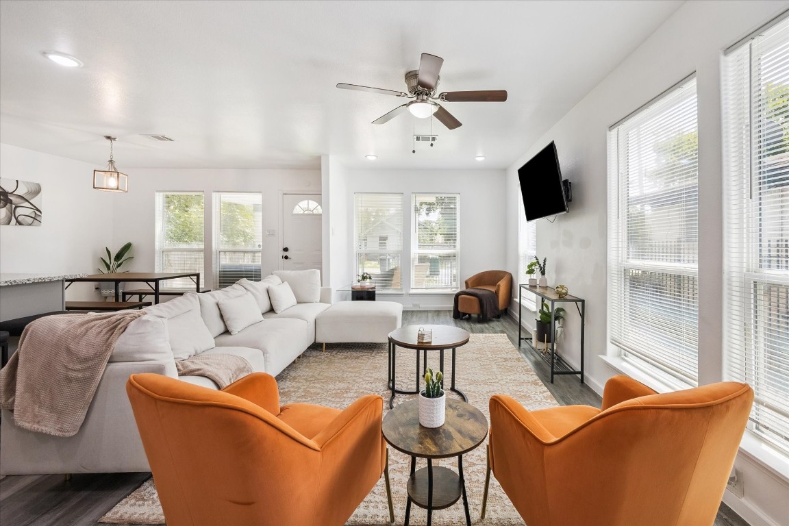 2631 Stevens Street Houston, TX 77026 - Photo 8 of 25 a living room with furniture a flat screen tv and large window
