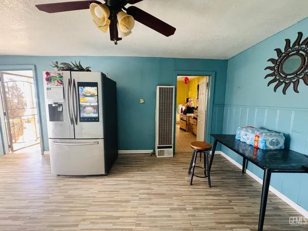a view of a livingroom with furniture and workspace