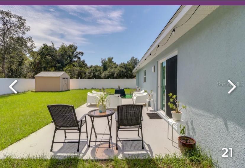 2081 Southwest 153rd Loop Ocala, FL 34473 - Photo 18 of 20 a patio with table and chairs