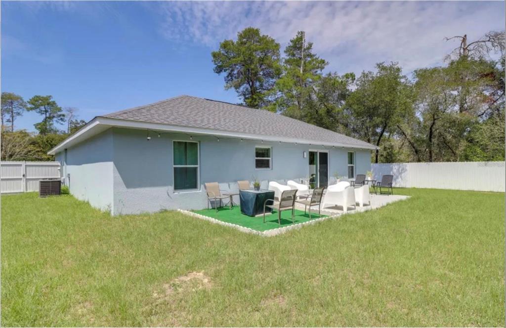 2081 Southwest 153rd Loop Ocala, FL 34473 - Photo 19 of 20 a front view of house with yard and outdoor seating