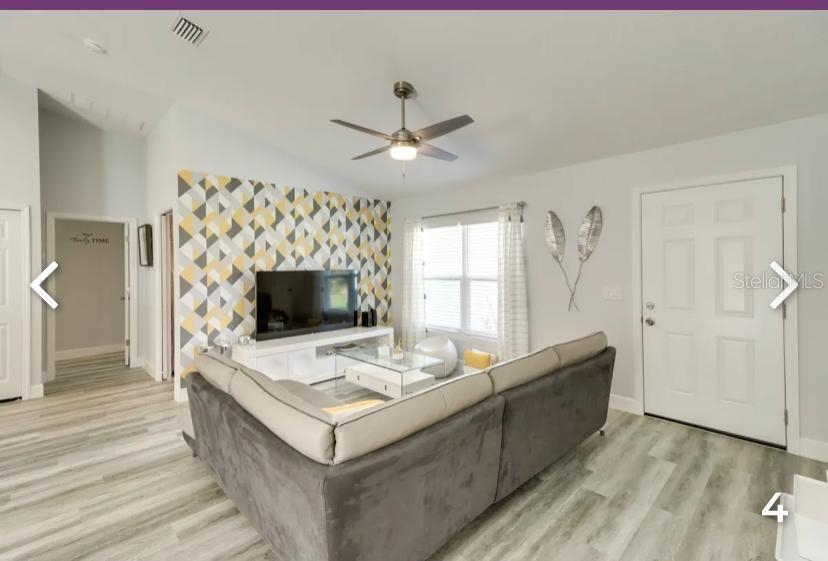 2081 Southwest 153rd Loop Ocala, FL 34473 - Photo 5 of 20 a living room with furniture and a flat screen tv